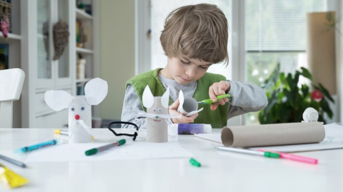 kid making sustainable craft