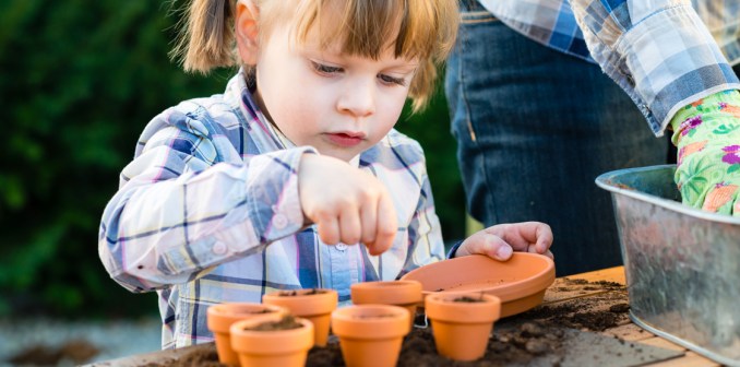 kid planting a garden - Environmentally sustainable activities