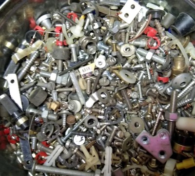A mess of assorted hardware from dismantled items