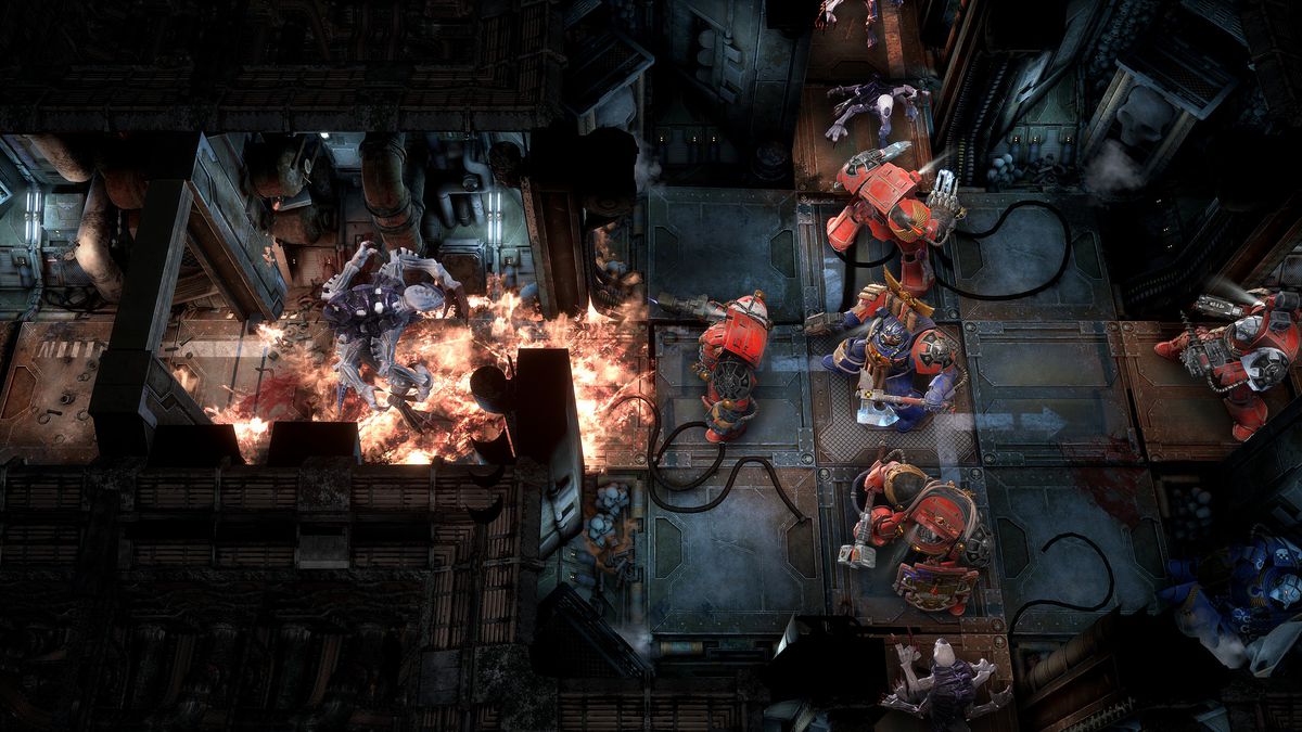 Space Marines battle through a corridor flooded with Tyranids in Space Hulk: Tactics
