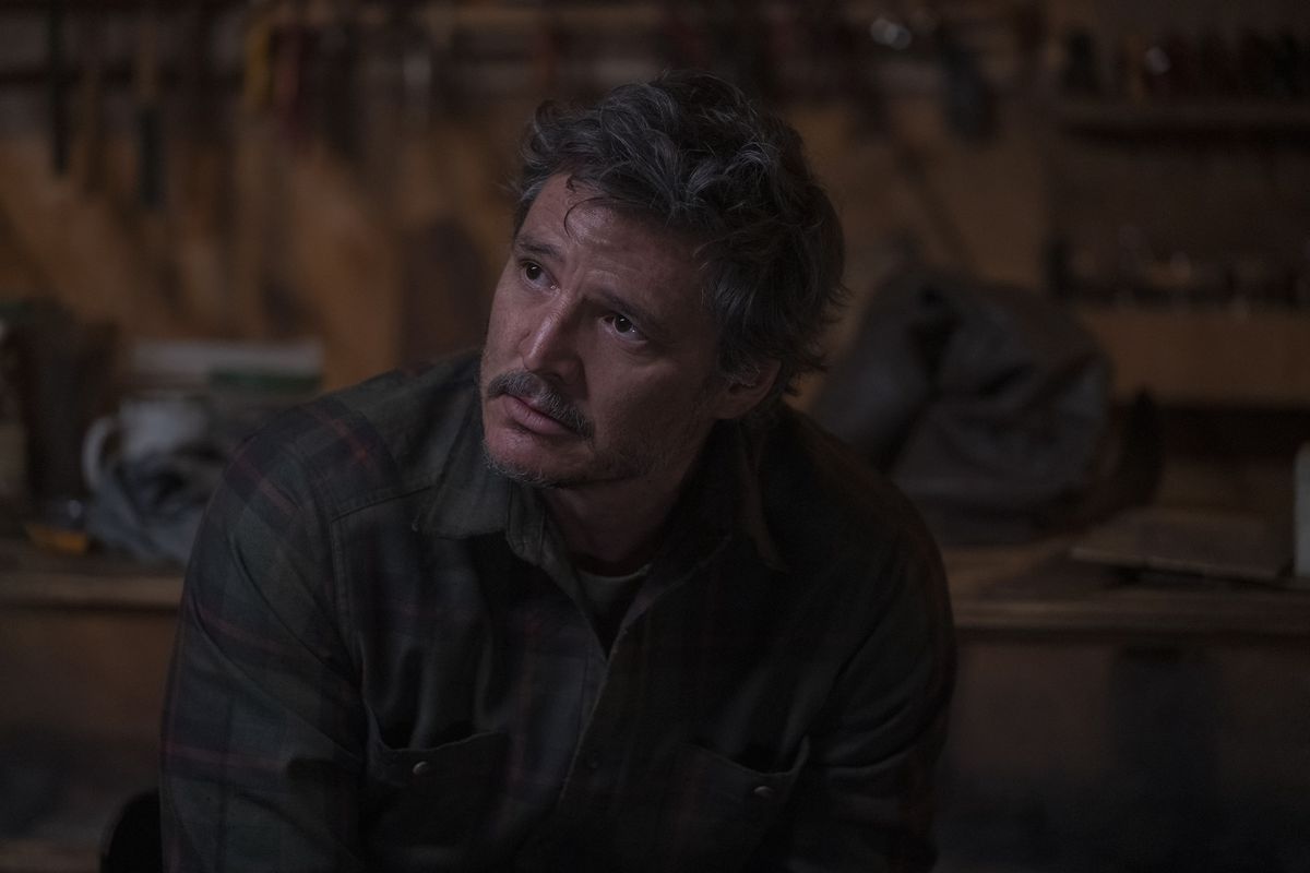 Pedro Pascal looks up skeptically in The Last of Us