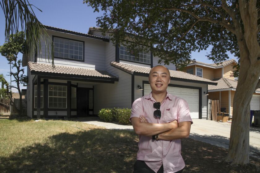 Rialto, CA - August 13: Kevin Chen usually flips homes to sell, but with the market slowing he is now choosing to rent out his property at 850 block of Mesa Dr. on Saturday, Aug. 13, 2022 in Rialto, CA. (Irfan Khan / Los Angeles Times)