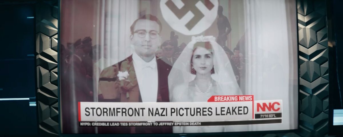 A screencap from The Boys of a close up on a TV showing an old black and white photo of a wedding couple with the chyron “Stormfront Nazi Pictures Leaked”