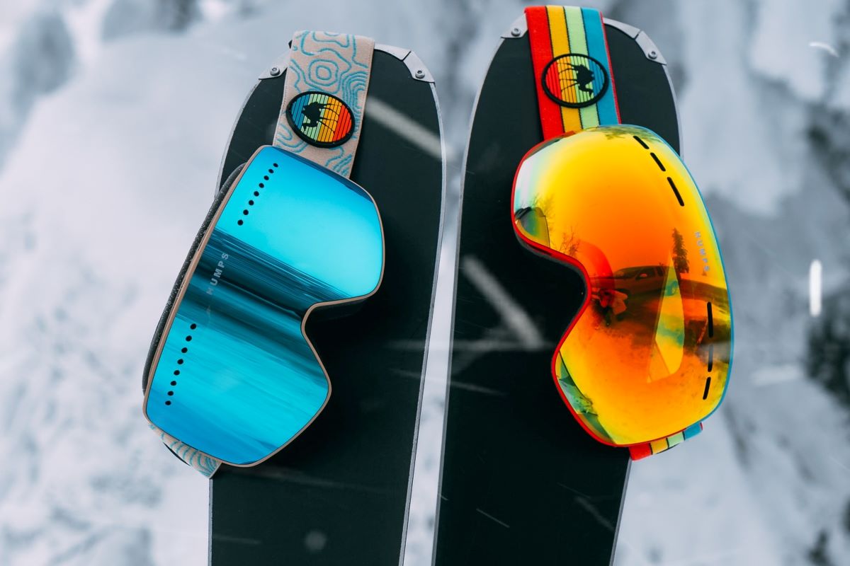 goggles hanging on skis