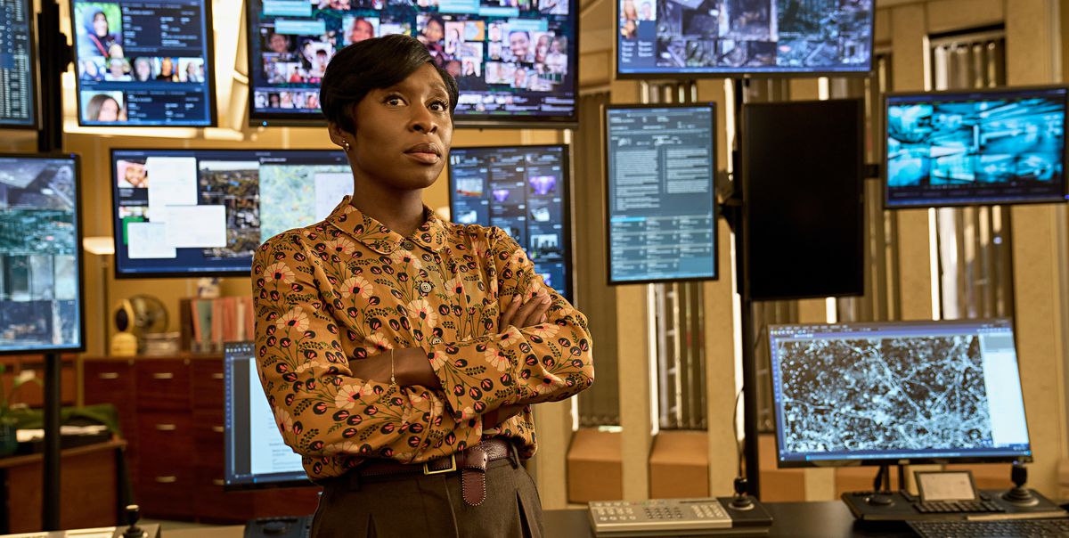 Cynthia Erivo, arms crossed, stands in front of an entire wall of monitors showing different images and data in Netflix’s Luther: Fallen Sun