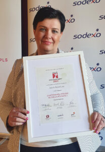 Lenka Vitásková holding the Employer of the Year award in the region 2023.Lenka graduated from the Mining University, Faculty of Economics with a focus on finance. For many years, Lenka worked in the energy company Innogy, where she focused on customer care and centralized customer service projects. After 13 years, Lenka moved to a Czech business company and was responsible for building and leading the HR department for 700 employees. Lenka has remained in the field of HR and gained experience in the HR world as an HR manager in a multinational company. In 2019, after returning to Northern Moravia, Lenka began working at Job Air Technic in Mošnov. Building, changing, and working with people is great, it can charge Lenka up, but also drain her. The job market is dynamic, so it is necessary for Lenka to constantly work on improvements and keep up with it at least to some extent. Lenka's interests include reading books about medicine, psychology, cycling trips, and skiing in the winter. Lenka lives by the motto: "The simplest and hardest thing is to tell the truth."