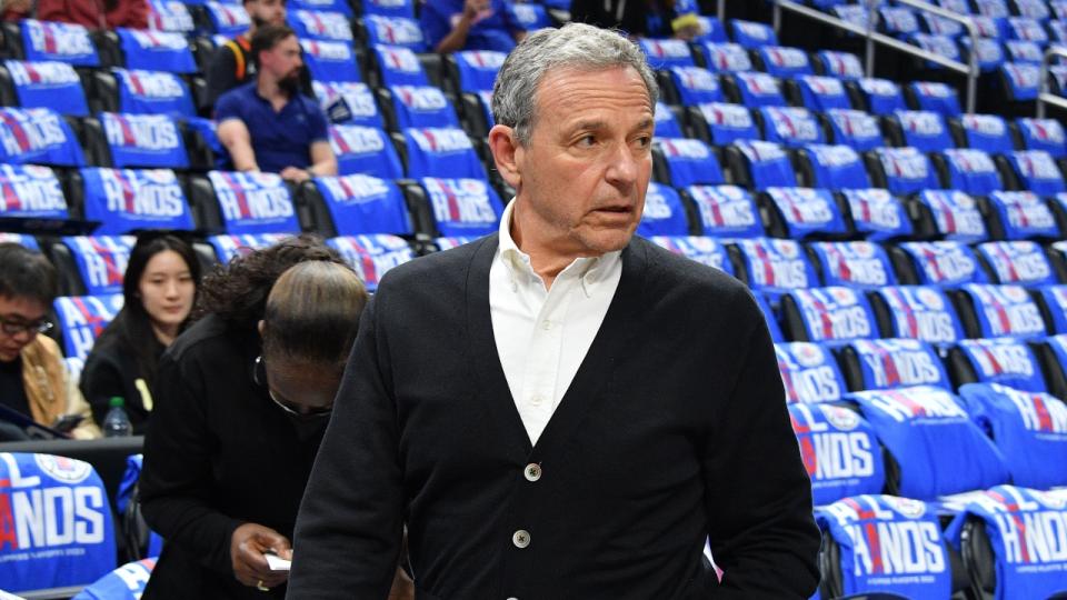 Bob Iger attends a basketball game