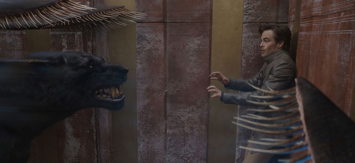 Edgin the Bard (Chris Pine) backs up against a wall in a panic as a displacer beast corners him in Dungeons &amp; Dragons: Honor Among Thieves