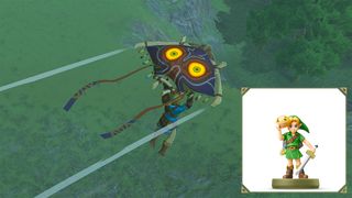 Link glides in Tears of the Kingdom using a glider inspired by the hood he wears in Breath of the Wild. The “Link (Rider) amiibo is in the bottom right corner.