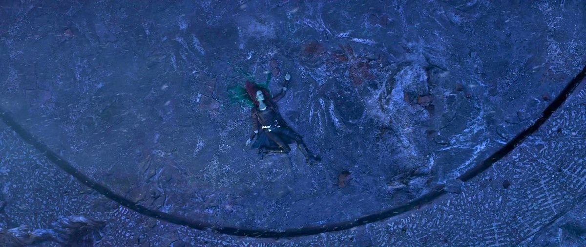 Gamora dead at the bottom of the Vormir Soul Stone sacrifice cliff bleeding green blood on to stone in Avengers: Infinity War