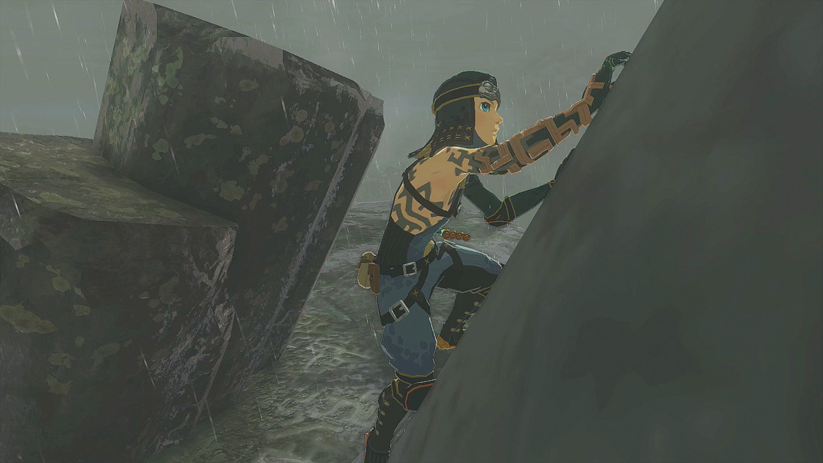 Link poses pointing up with a smile on his face wearing the full Frostbite Armor set in Zelda: Tears of the Kingdom