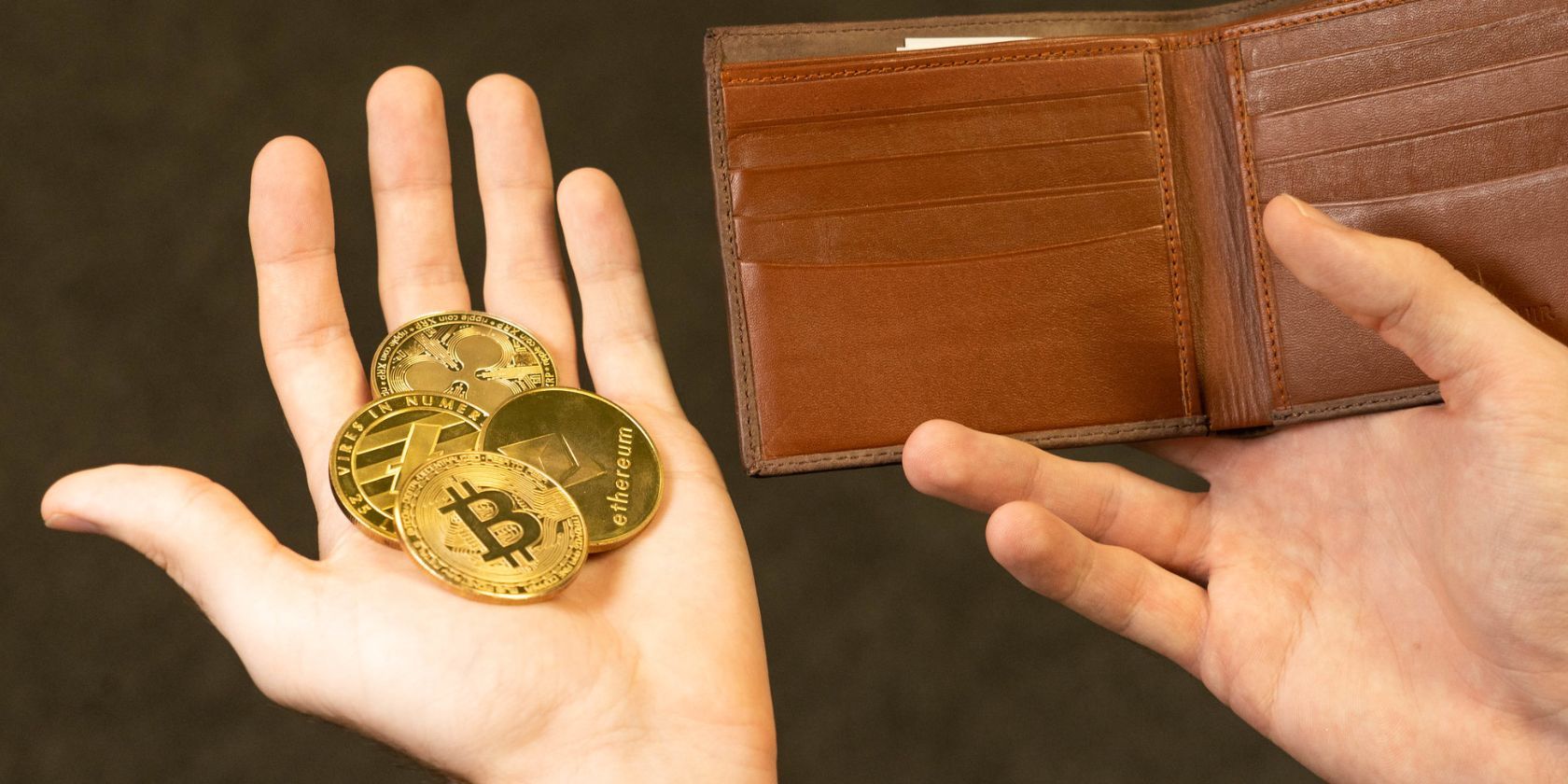 Person Holding Crypto Coins In One Hand And Leather Wallet In The Other