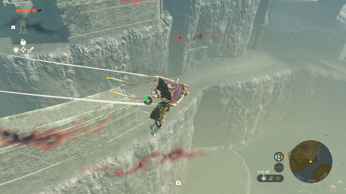 Link glides by a cliff near Hyrule Castle in Zelda Tears of the Kingdom.