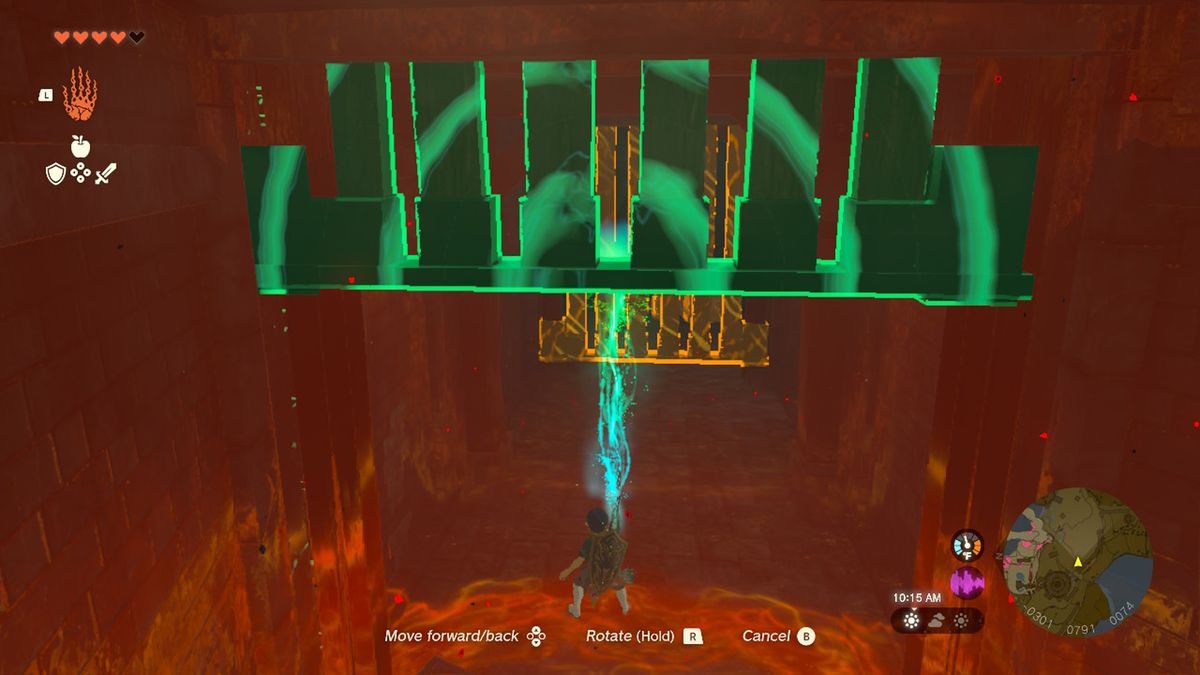 Link uses Ultrahand to lift a gate in Zelda Tears of the Kingdom.