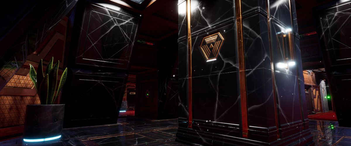 A lobby-esque room on the space station the System Shock remake, replete with marbled-granite pillars and art deco trappings