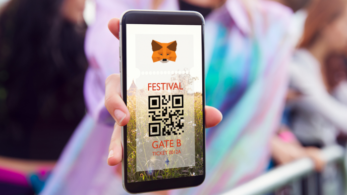 A festival ticket on a phone featuring the metamask and ethereum logos