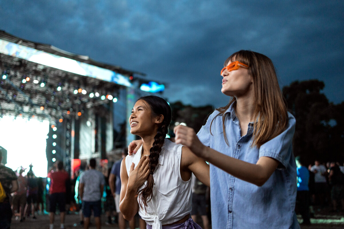 Two women enjoying a music festival