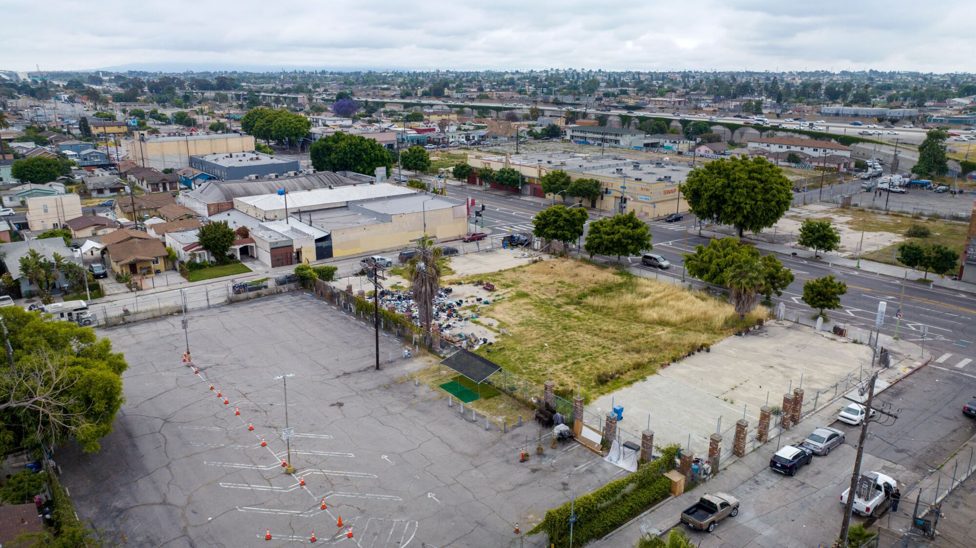 A civic group has identified a city parking lot near 87th St. and Broadway, left, as a potential site for homeless housing