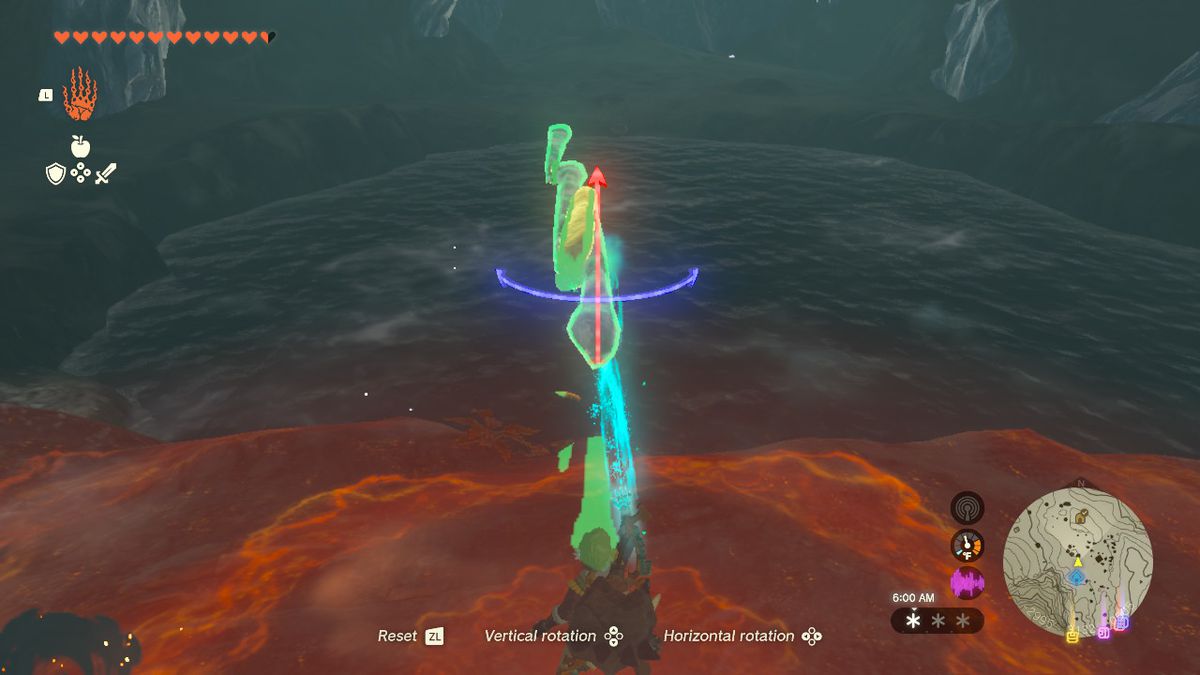 Link holds three long icicles attached together with Ultrahand over a pond.