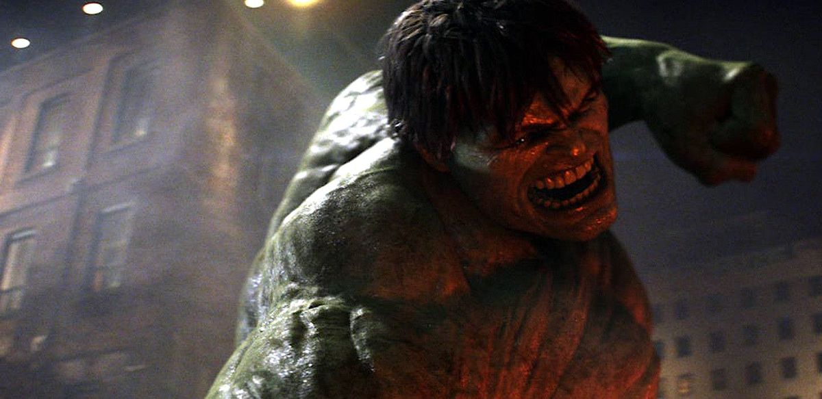 A grimacing Hulk, lit from below with a dark red light, snarls and prepares to smash something in the 2008 Incredible Hulk