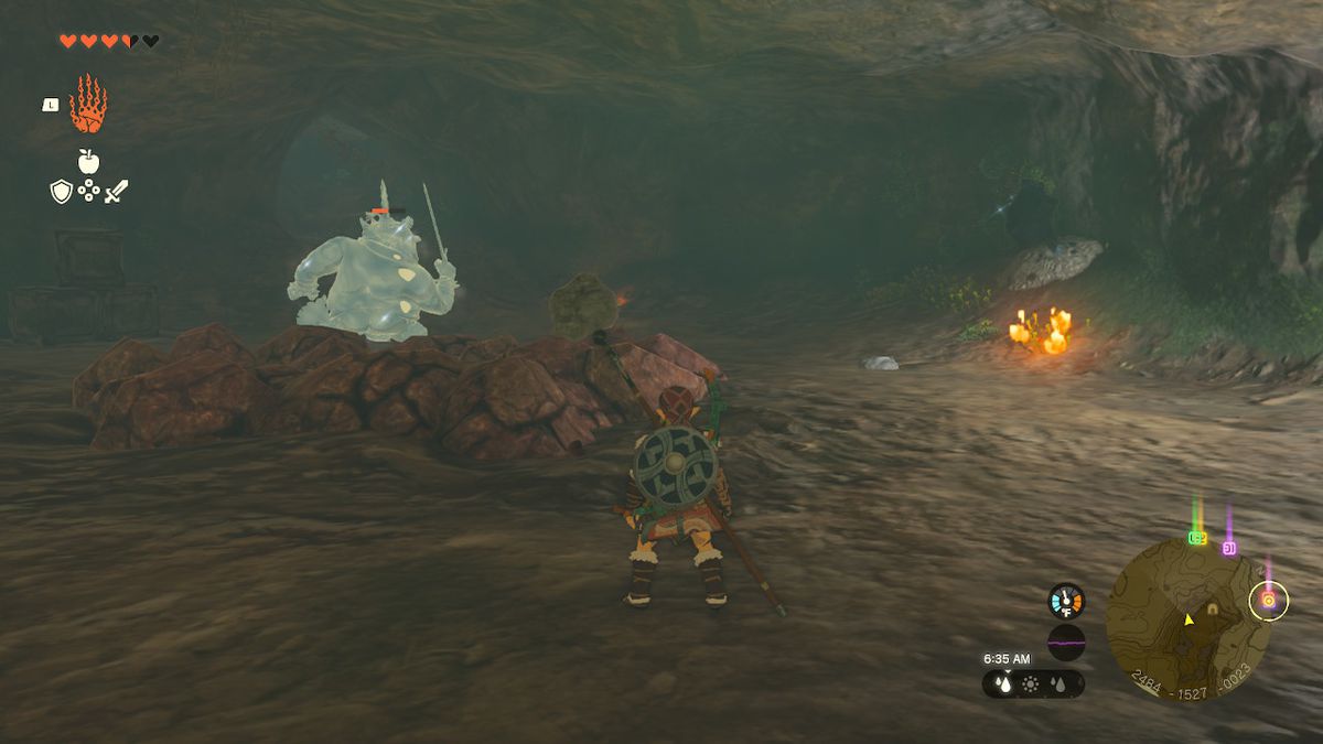 Link stands in a room with a frozen Bokoblin, and a patch of rocks on the ground in Zelda: Tears of the Kingdom
