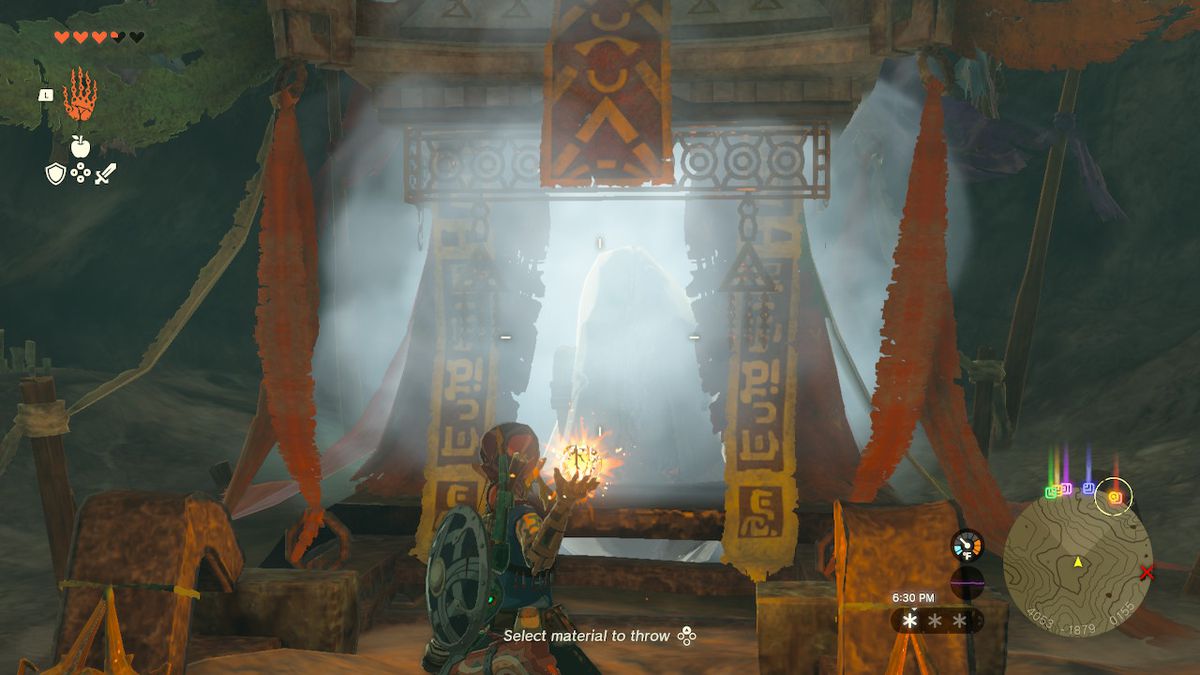 Link prepares to throw Fire Fruit to melt ice covering a chest in Zelda: Tears of the Kingdom
