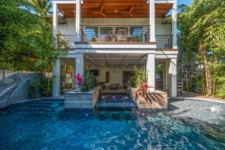 Backyard with a private pool and lounging space, a popular luxury home feature in Sarasota