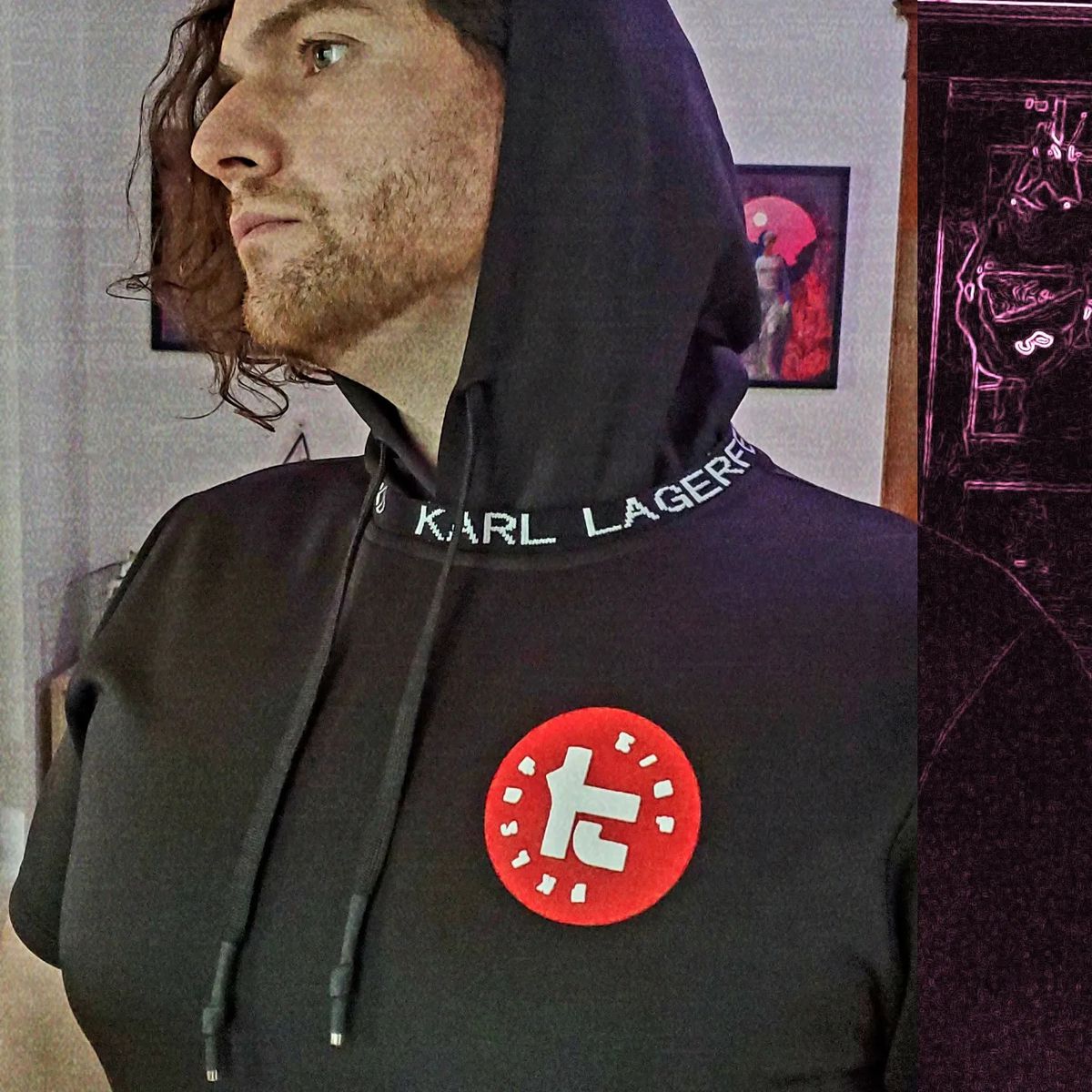 A photo shows a Karl Lagerfeld short-sleeve hoodie, customized with the iconic white-on-red logo of the high-fashion designer brand Toni Kensa from Splatoon