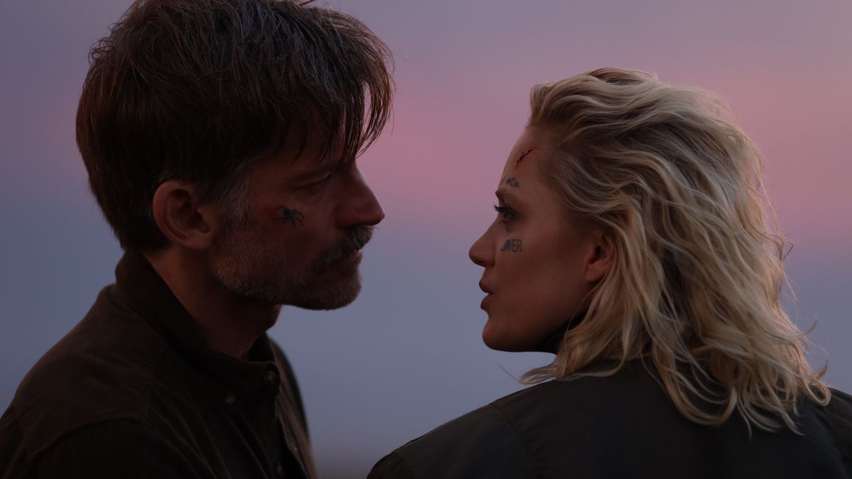 (L-R) Nikolaj Coster-Waldau and Maika Monroe with tattoos on their face in God Is a Bullet.