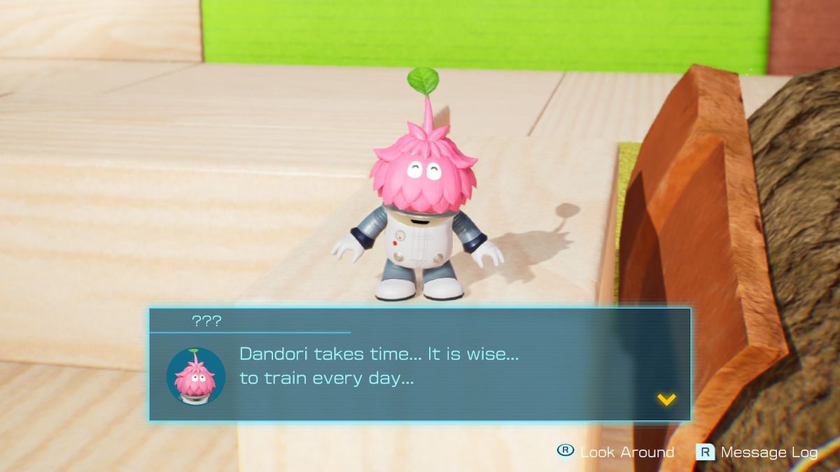 A pink, shaggy character tells the player about Dandori Trials in Pikmin 4