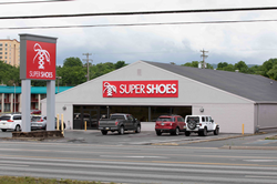 Renovated Super Shoes store in Altoona, PA. The building is gray with a red and white Super Shoes sign.
