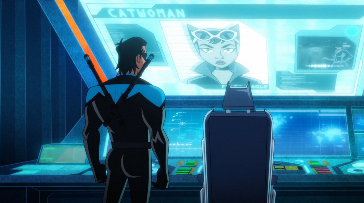 Nightwing stands in front of a batcomputer display of Catwoman with his ass very prominently illustrated in season 4 of Harley Quinn