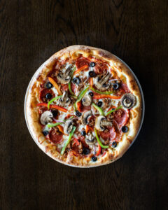 Perfección en la elaboración: pizza Bubba's 33 Signature One Topping de 12" - GroupRaise