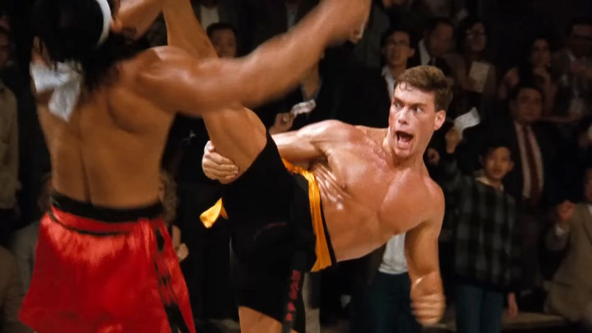 Jean-Claude Van Damme as Frank Dux split-kicks Chong Li (Bolo Yeung) in the climactic battle from Bloodsport