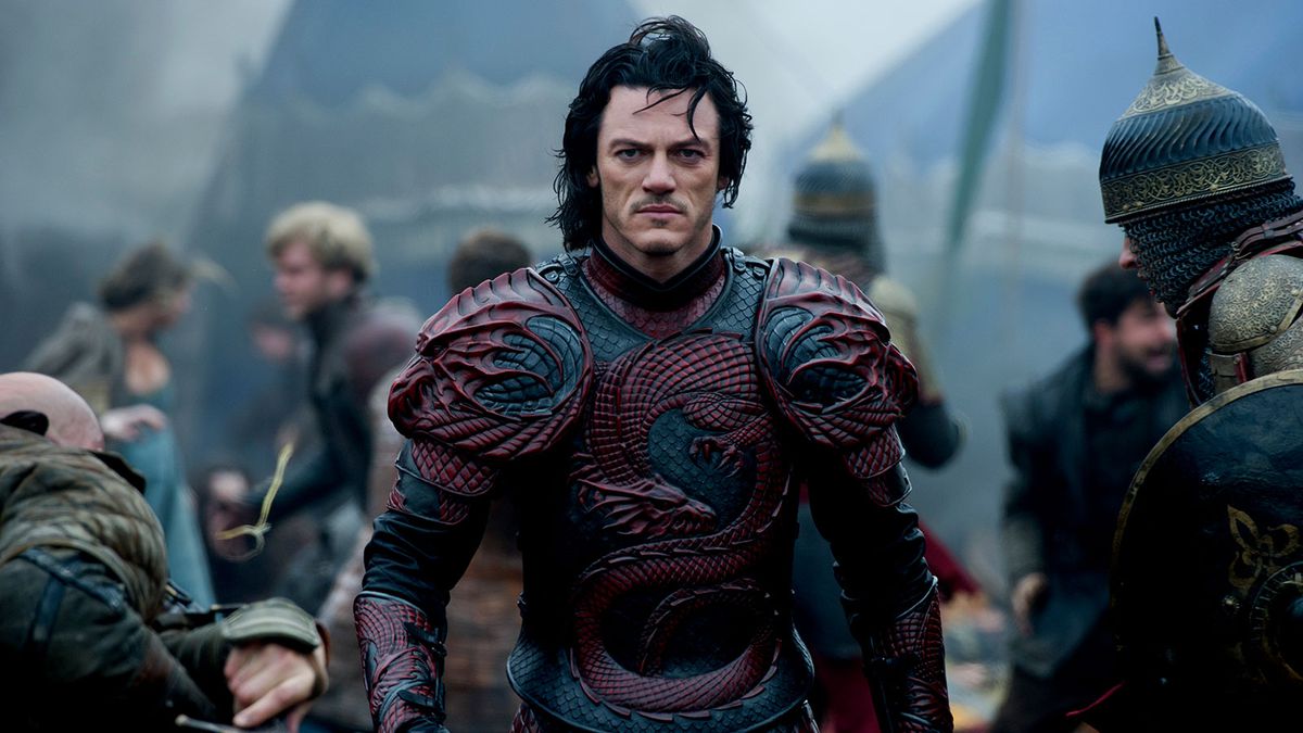Luke Evans wears medieval armor with red dragons on it in Dracula Untold.