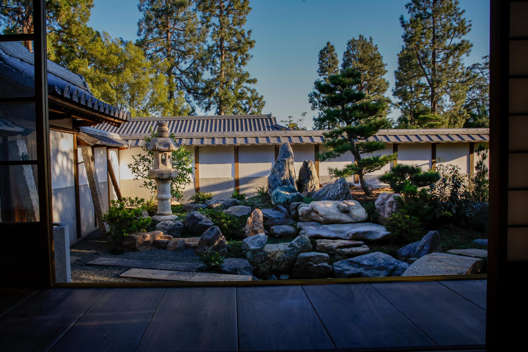 The exquisite Japanese garden of distinctive stones, pond, trees and shrubs outside the shōya's grand room for dignitaries.
