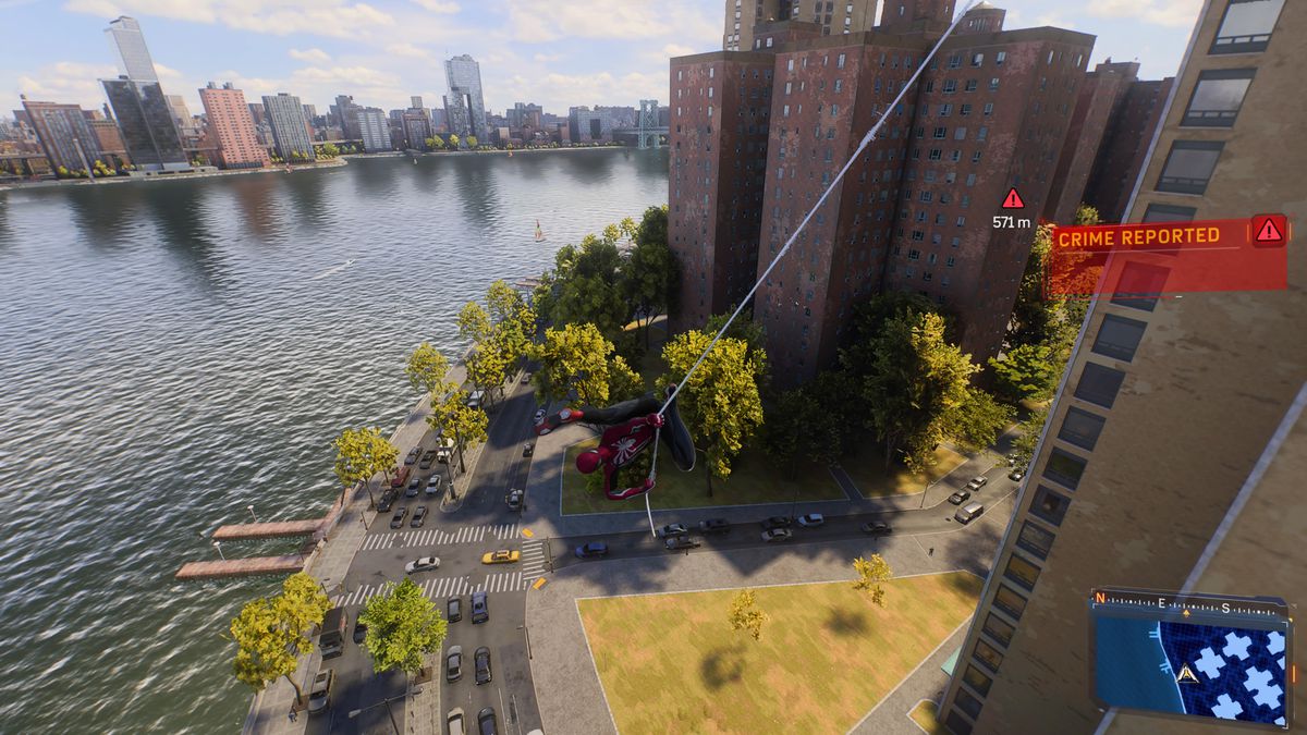 Spider Man swings above the FDR in Manhattan in Spider Man 2 on PS5.