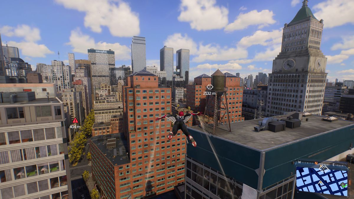 Spider Man soars above buildings in manhattan in Spider Man 2 on PS5.