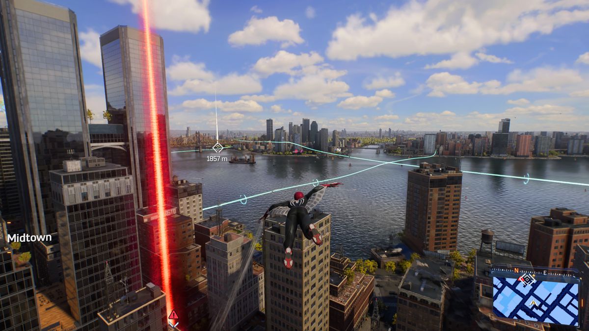 Spider Man soars toward the east river in Spider Man 2 on PS5.