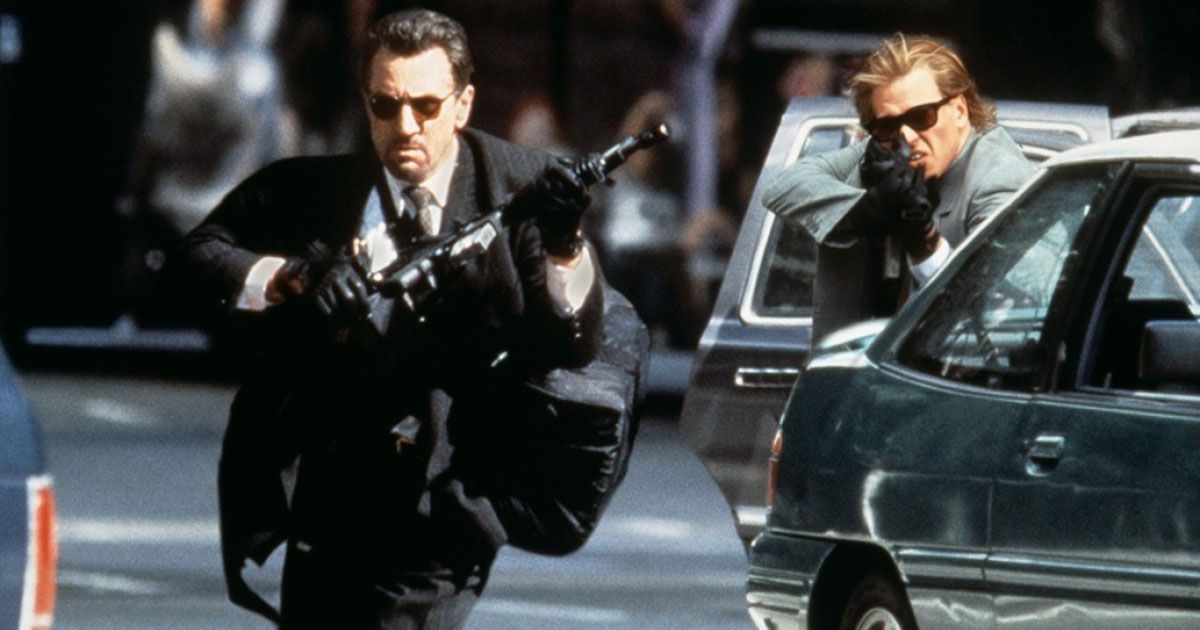 Professional bank robbers Neil McCauley (Robert De Niro) and Chris Shiherlis (Val Kilmer) touts guns in a heated standoff with police.