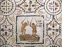 Two men crushing grapes on the September panel from the 3rd-century mosaic of the months at El Djem, Tunisia (Roman Africa). 