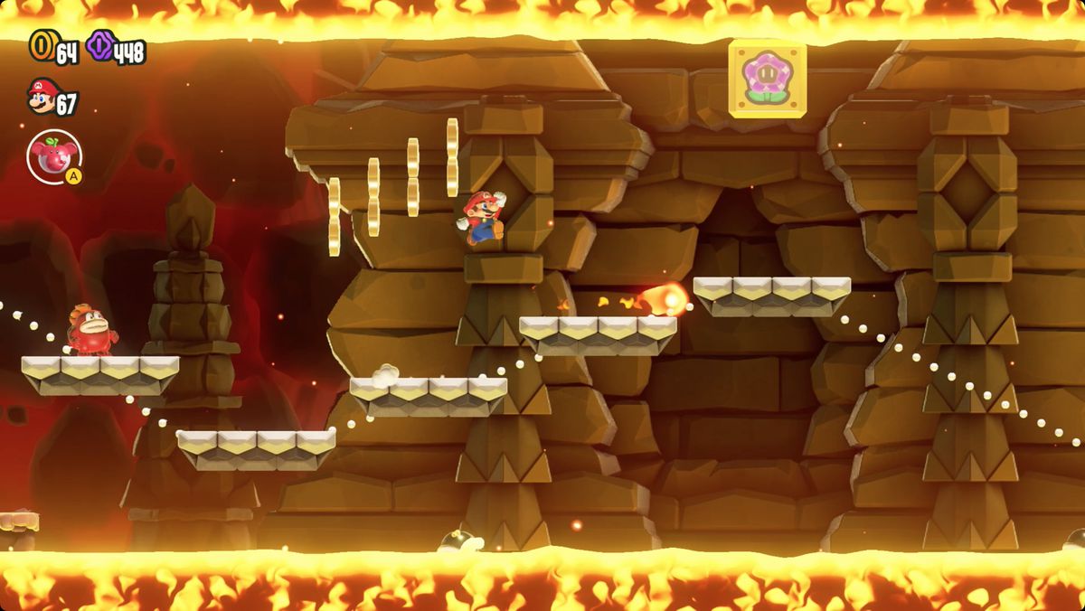 Super Mario Bros. Wonder Wavy Ride through the Magma Tube screenshot showing the Wonder Flower location.