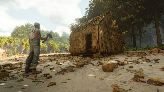 En skärmdump från Ark: Survival Ascended som visar spelarkaraktären stod utanför en enkel stuga med halmtak byggd på stranden av en flod.
