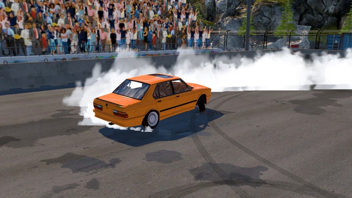 A cheap yellow car with smoke on a grey track