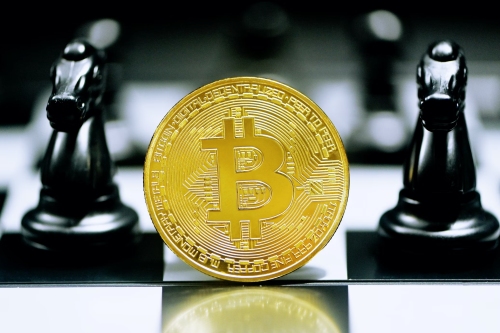 Unsplash Kanchanara Bitcoin flanked by two knights - Ex-Binance CEO CZ Faces Up to 10 Years in Prison