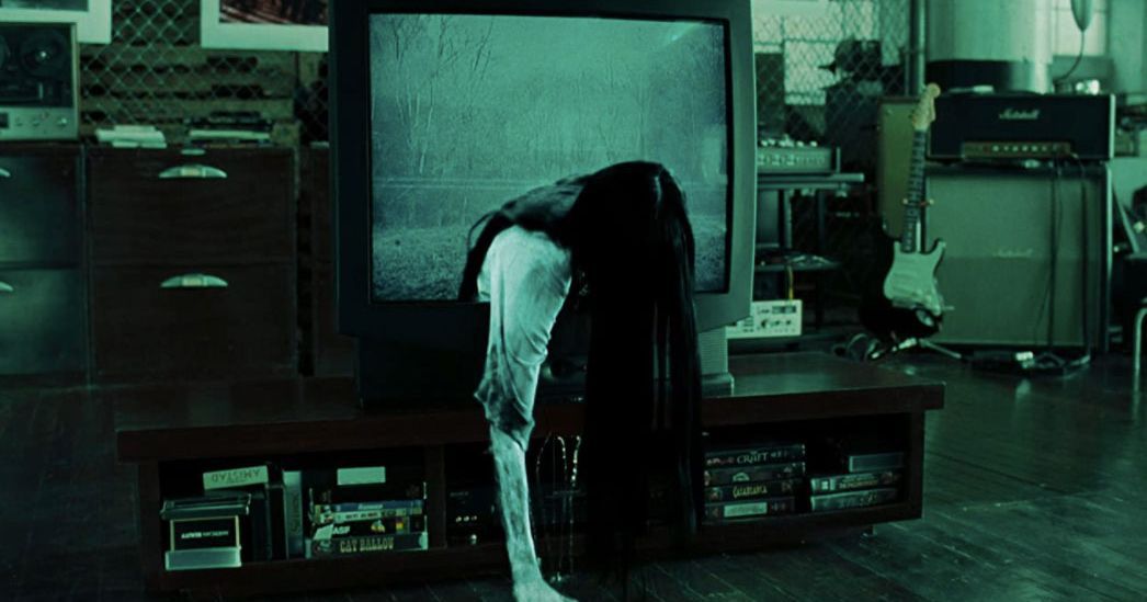 Sadako Yamamura crawling through a portal in a television