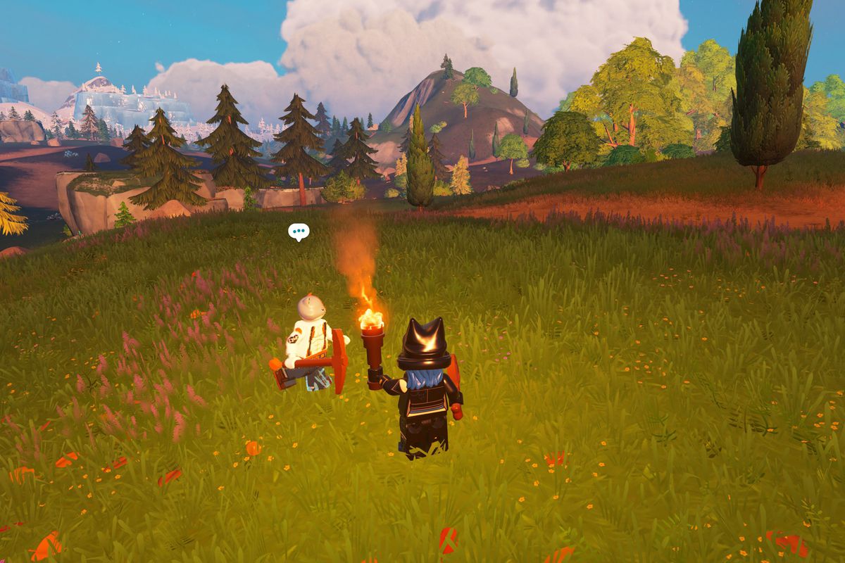 A Lego Fortnite character stands with an NPC, Meowscles, in a grassy field