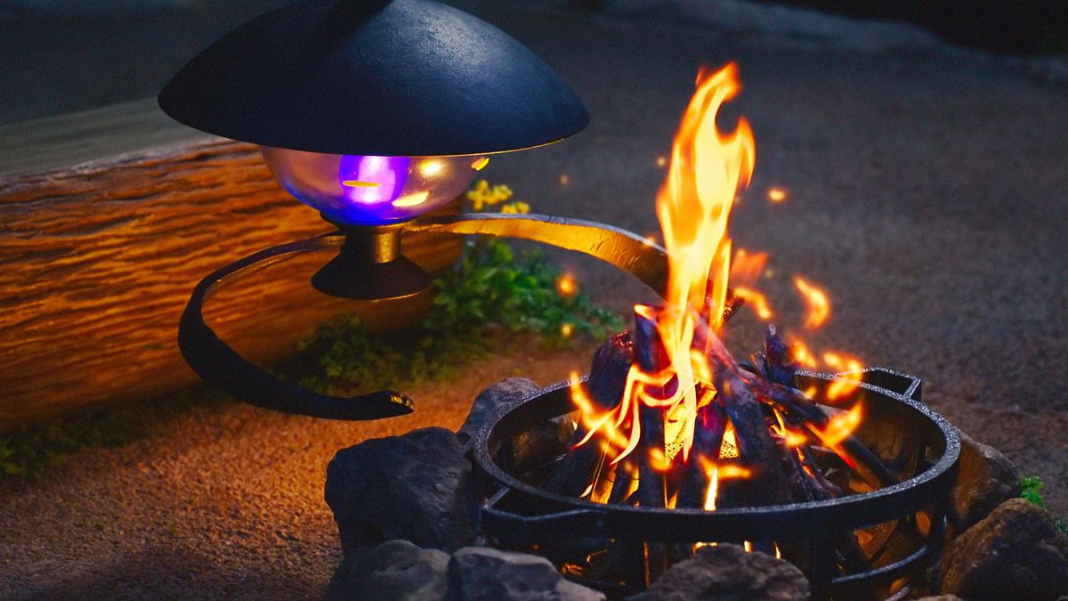 A Lampent helps start a campfire