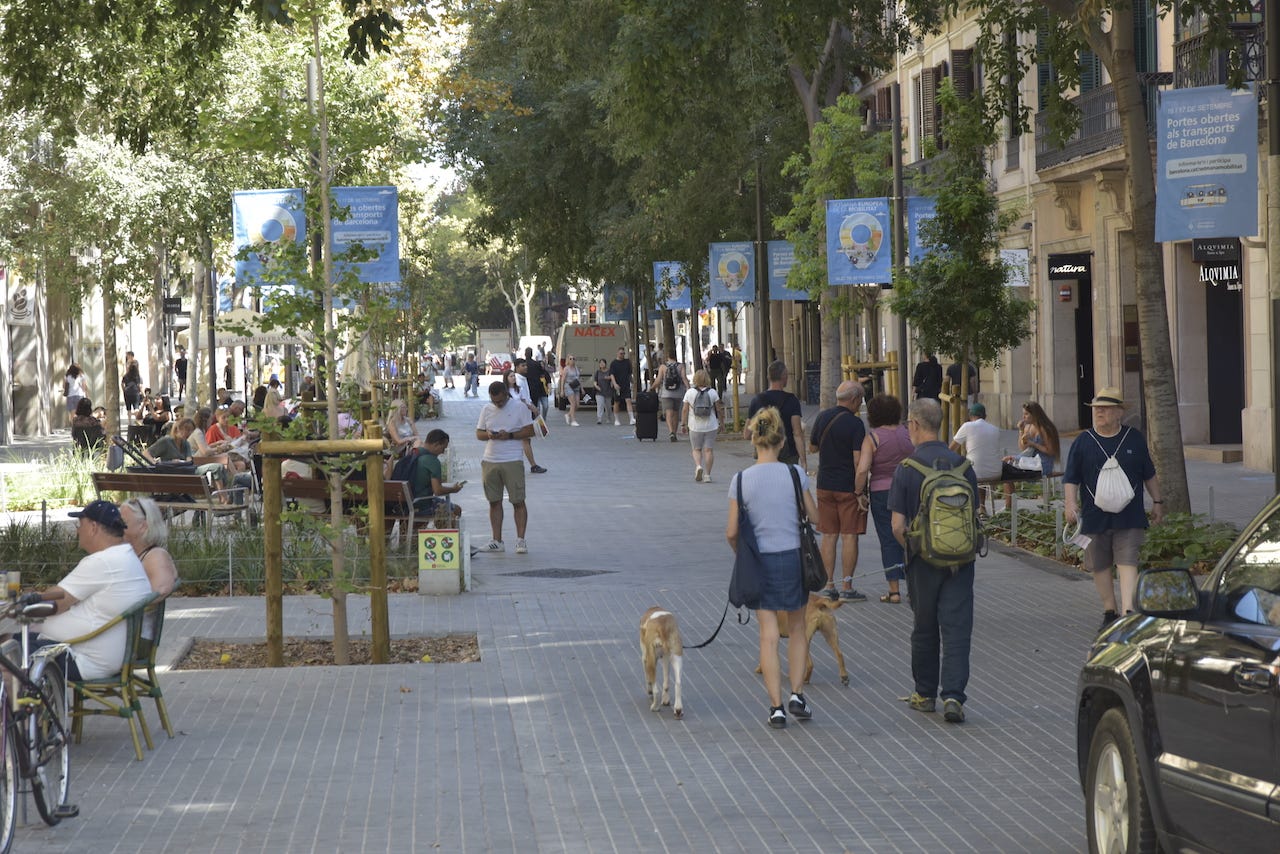 Several people walk along Consell de Cent street on September 8, 2023, in Barcelona, Catalonia, Spain.