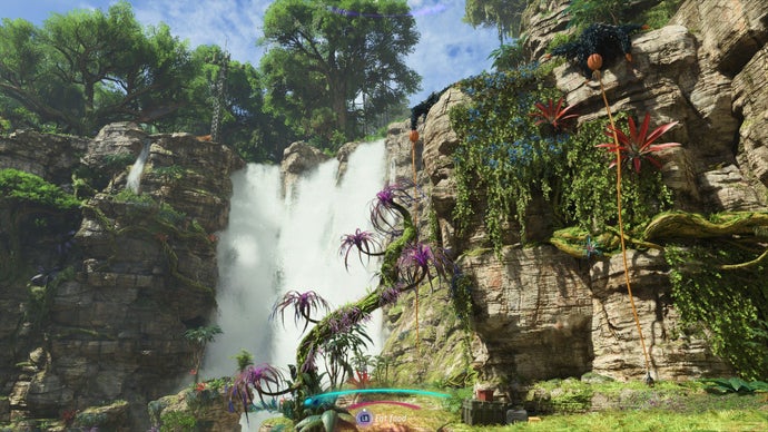 We see a waterfall, and two orange fruits dangling climbable ropes in Avatar: Frontiers of Pandora.